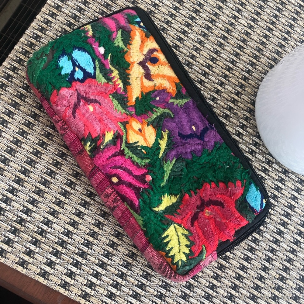 Multicolored cloth wallet zipper style.